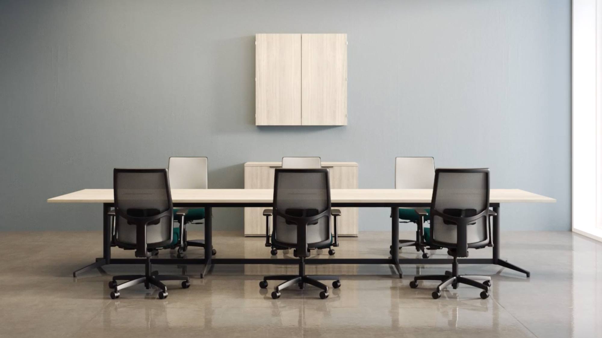 large conference table with six ergonomic chairs